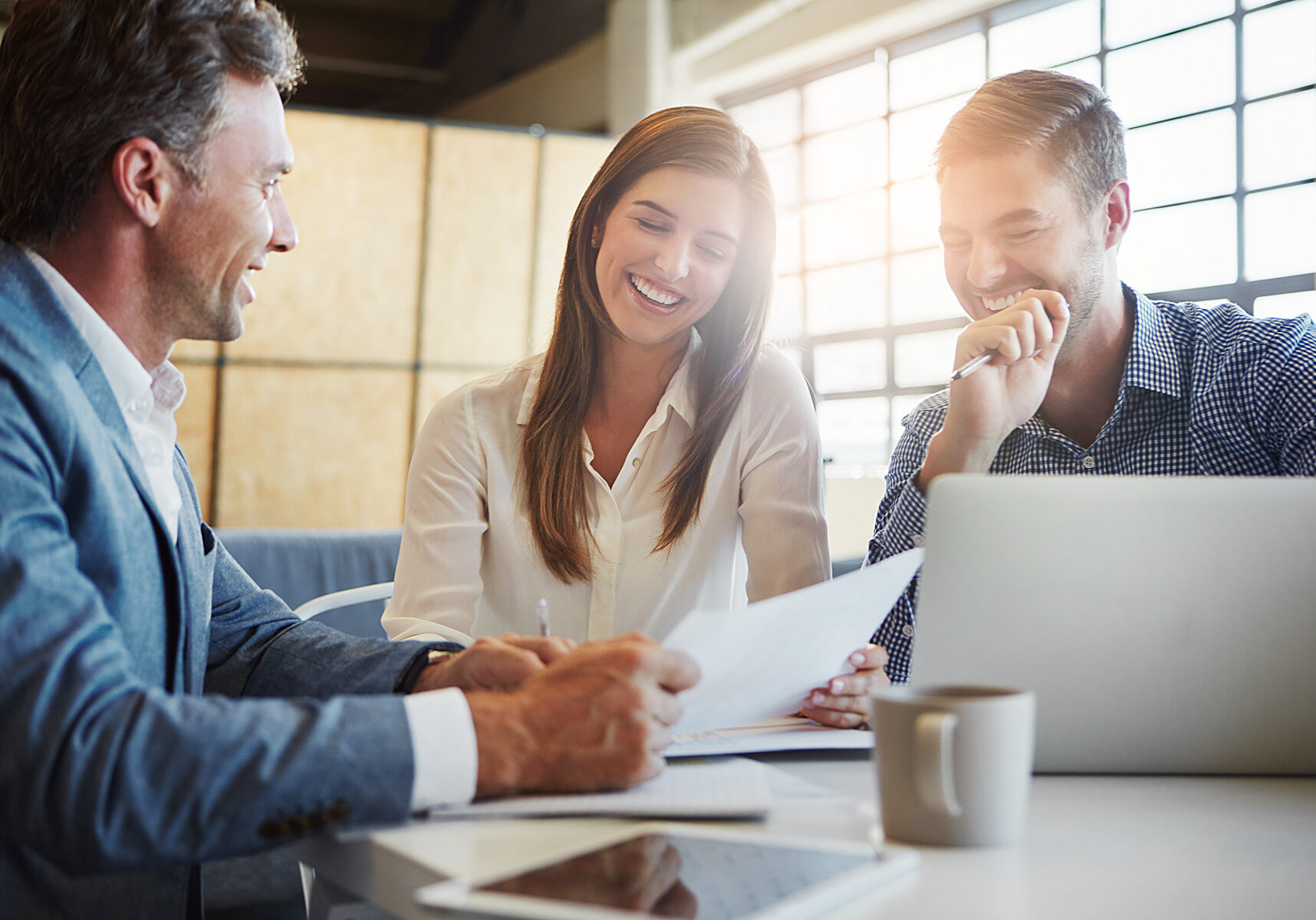 Cropped shot of three businesspeople working in the office